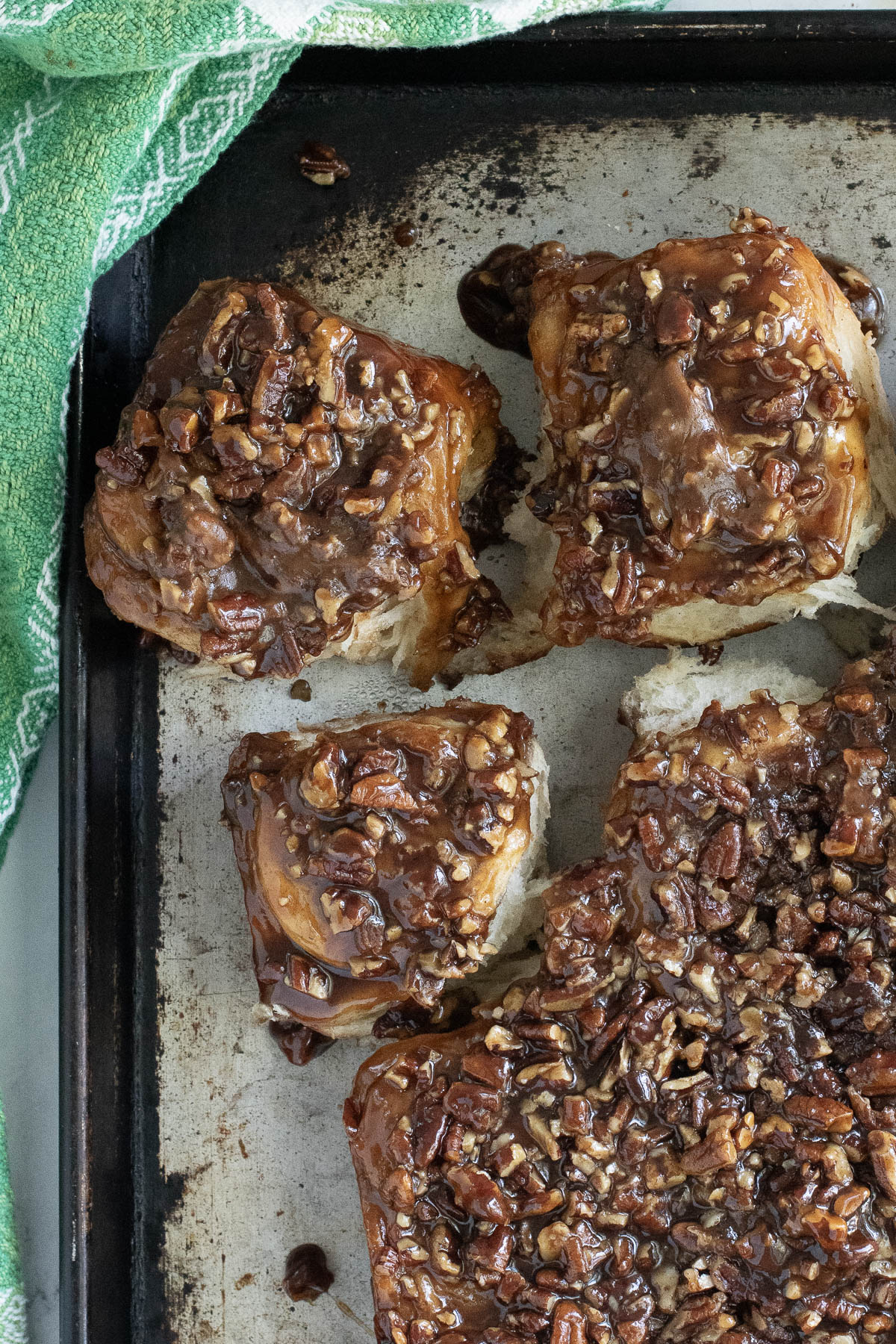 sourdough sticky buns on a sheet pan.