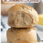 an image of rye and molasses dinner rolls for pinterest with text overlay.