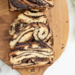 a pinterest image for sourdough chocolate babka with text overlay.