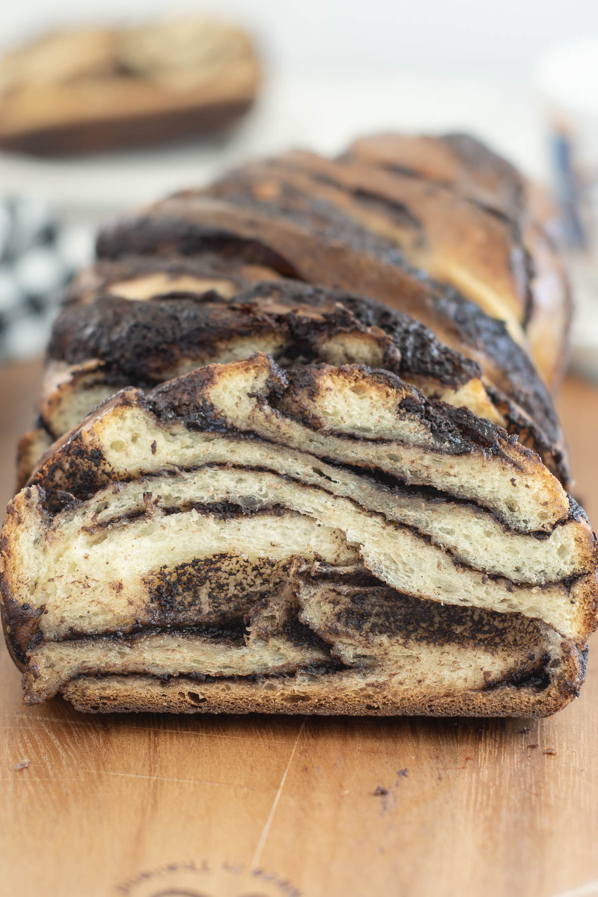 a sliced sourdough babka loaf on a cutting board.