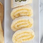 a pinterest image for lemon swiss roll cake with text overlay,