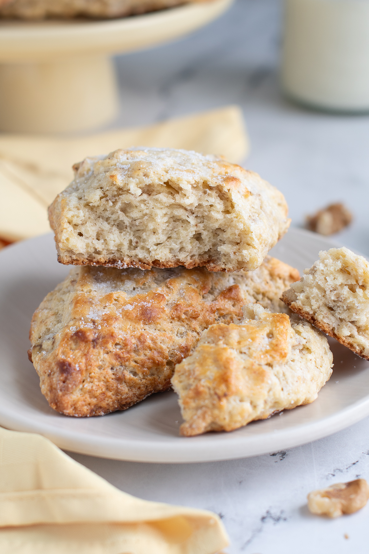 two scones on a white plate. Once cut open.