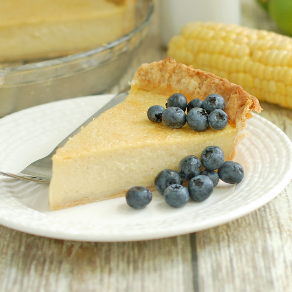 a slice of buttermilk pie on a white plate.