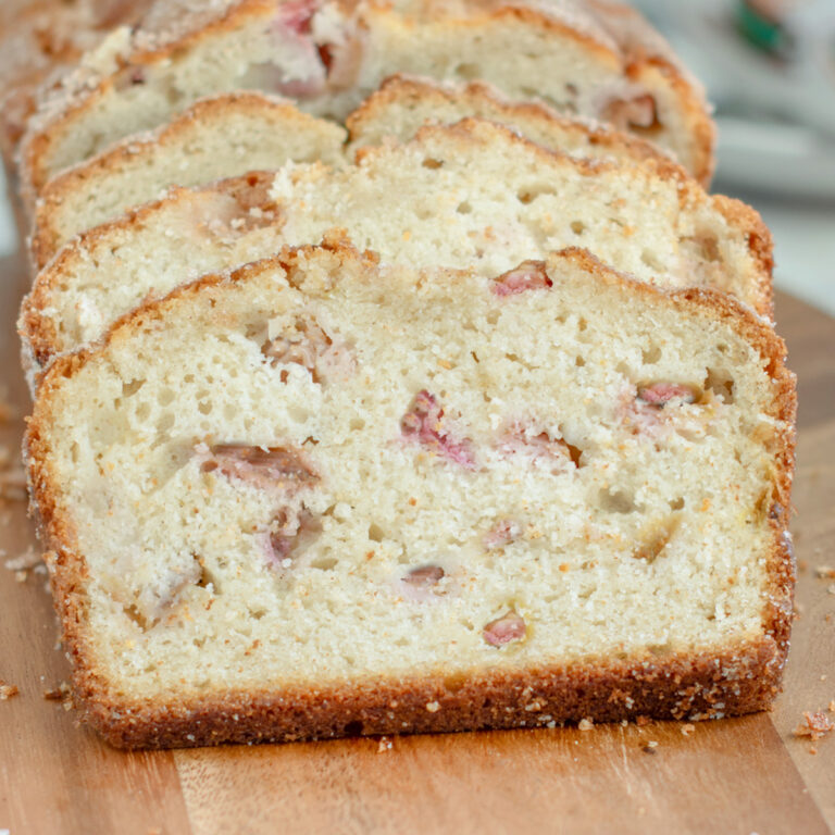 slices of rhubarb quick bread on a cutting board.