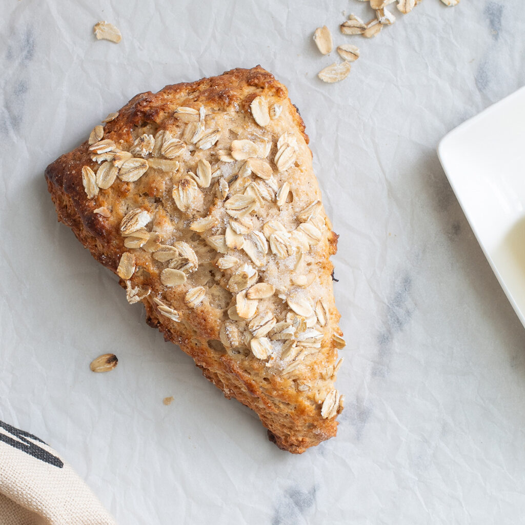 an oatmeal scone on parchment paper.