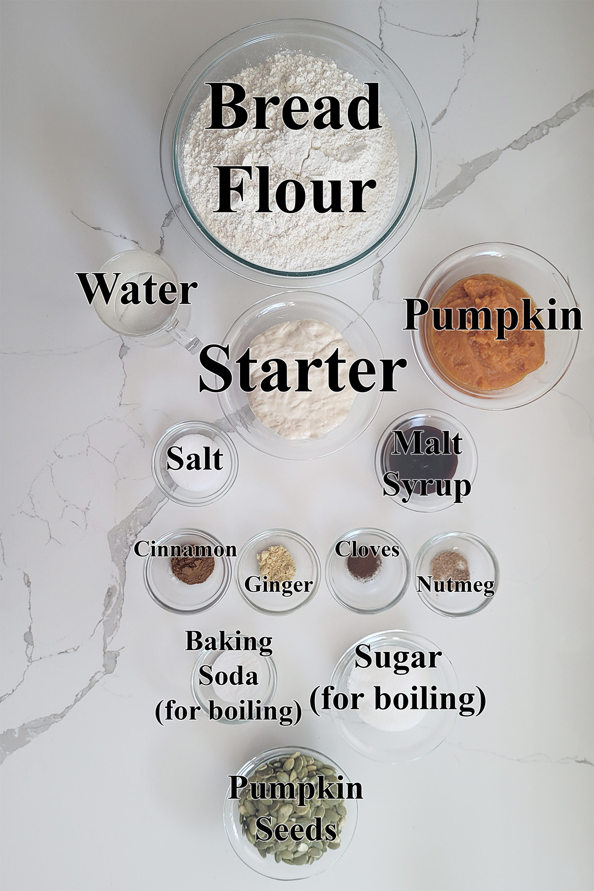 ingredients for sourdough pumpkin bagels in glass bowls.