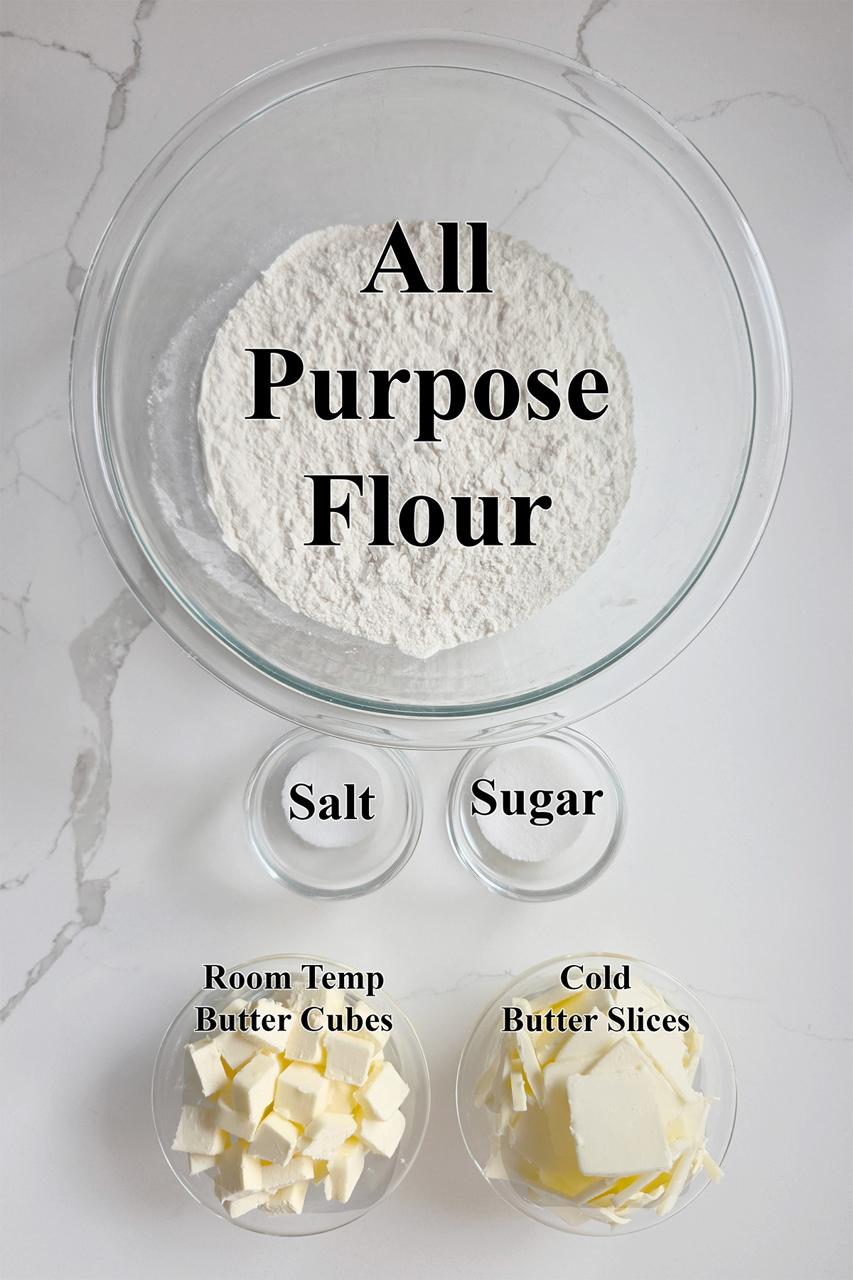 ingredients for all butter pie crust in glass bowls.